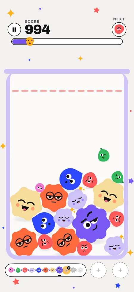 A jar of googly blobs mid-game, with the score and the next blob at the top
